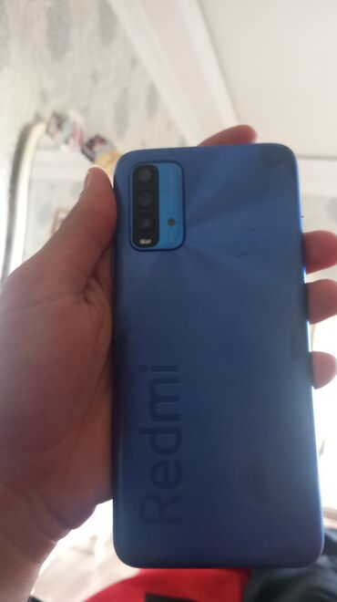 телефон fly e110: Xiaomi Redmi 9T, 64 ГБ, цвет - Синий, 
 Отпечаток пальца, Две SIM карты