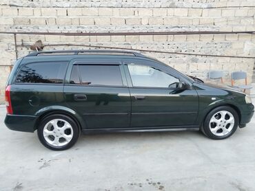 Opel: Opel Astra Caravan (universal) – tünd yaşıl rəng • Kuzov: universal — 8