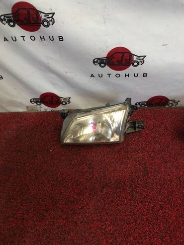 Другие автозапчасти: Фара Mazda Demio DW3W 1300 2001 перед. лев. (б/у) КУЗОВНЫЕ ДЕТАЛИ -