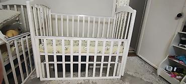 bunk bed: Детская кроватка, качалка классического типа с реечными высокими — 1