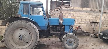 kreditlə masinlar: Mavi rəngli MTZ tipli təkərli traktor Xüsusiyyətlər: - Dizel — 1