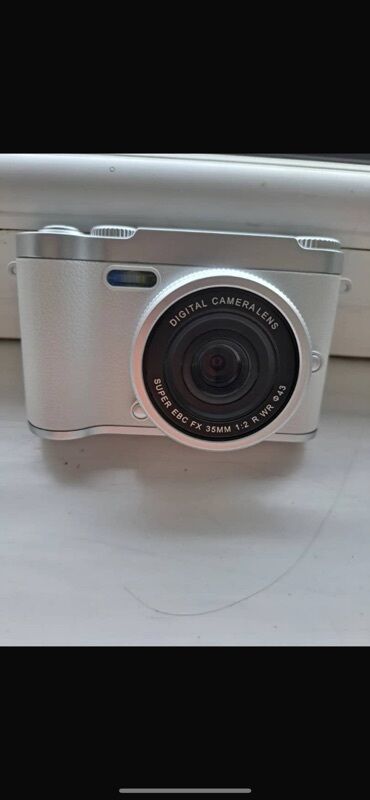 продать фотоаппарат canon: Цифровая фотокамера в белом корпусе с серебристыми элементами