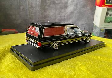 Avtomobil modelləri: Коллекционная модель Mercedes-Benz 200 W123 Hearse black 1982 Schuco — 22