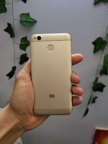 телефон fly с большим аккумулятором: Xiaomi Redmi 4X, 16 ГБ, цвет - Золотой, 
 Сенсорный, Отпечаток пальца, Две SIM карты