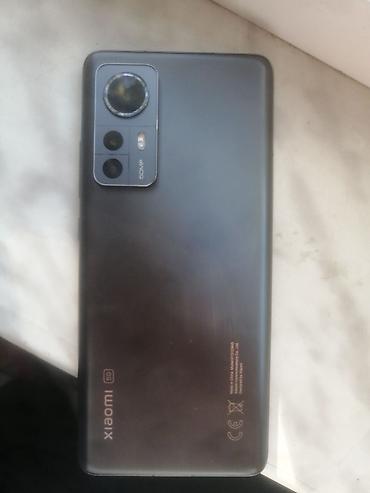 Mobil telefon və aksesuarlar: Xiaomi 12, 128 GB, rəng - Qara, 
 İki sim kartlı — 1