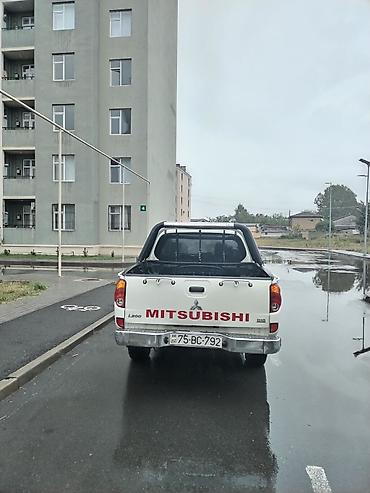 235 55 18: Mitsubishi L200: 2.4 l | 2008 il 302118 km Pikap — 6