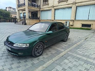 kredit avtomobil: Opel Vectra sedan – tünd yaşıl rəng, 4 qapı, 5 yerlik. Şəhər və tras — 1