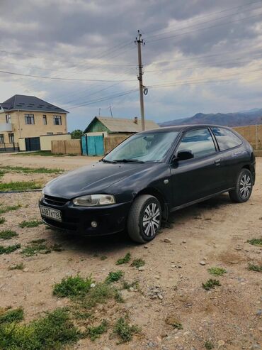 опел вектора с: Автомобиль Mitsubishi Colt 3-дверный хэтчбек черного цвета. Модель