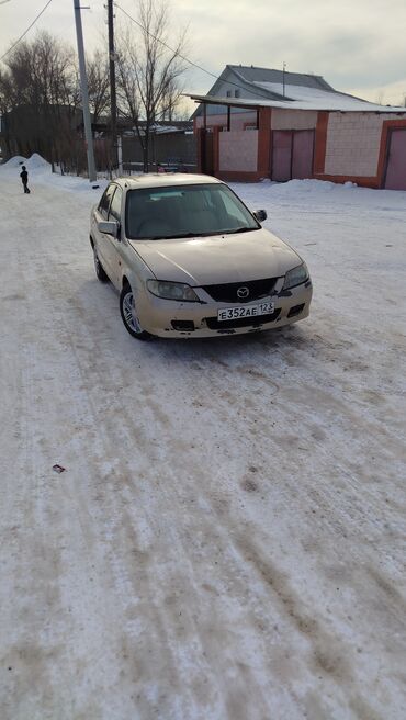 машиналар: Mazda Familia: 2003 г., 1.5 л, Автомат, Бензин, Седан