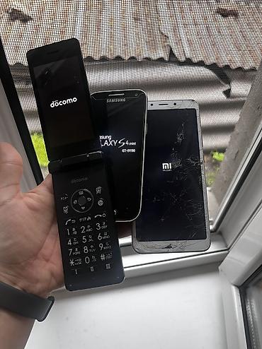 Другие мобильные телефоны: Два телефона. 1) Кнопочный раскладной телефон NTT Docomo (японская — 1