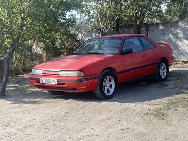 двигатель мазда 6 2.0 дизель купить: Красное двухдверное купе Mazda 626. Автомобиль оснащен пятиспицевыми