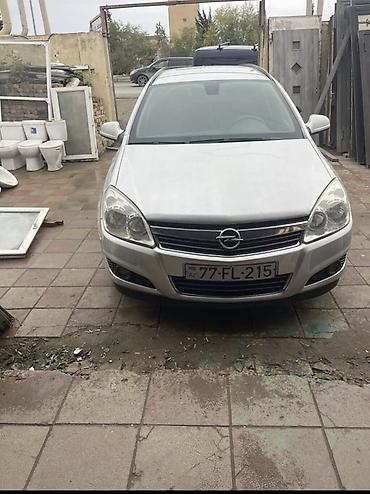 опел: Opel Astra Caravan (universal), gümüşü rəng. Texniki və funksional — 6