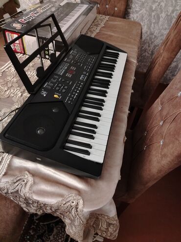 aga musiqi aletleri: Sintizator 61 dil 6 demo mahnı 16 ton 10 ritim 2 öyrədici mod Az