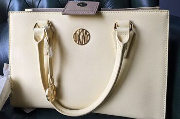 Çantalar: Orjinal 300$ alinib DKNY markasi dunya brendi 250 manata satilir ciddi