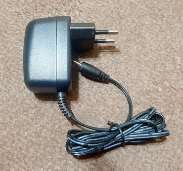 Računarska oprema: AC/DC adapter, ispravljač 12V, 50mA Model RR-28-1200050D Input 230V