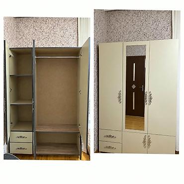 Üç qapılı paltar dolabı - Rəng: krem (ön hissədə dekorativ naxışlar) lalafo.az -da Üç qapılı paltar dolabı - Rəng: krem (ön hissədə dekorativ naxışlar)