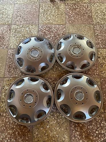 opel astra k: 4 ədəd gümüş rəngli təkər qalpakı (disk qapağı) dəsti. - Rəng — 1