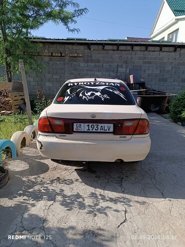 Mazda: Mazda 323: 1996 г., 1.5 л, Механика, Бензин, Седан
