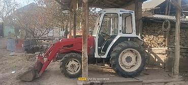 Тракторы ДТ-75: Трактор с фронтальным погрузчиком и навесным оборудованием Описание — 6