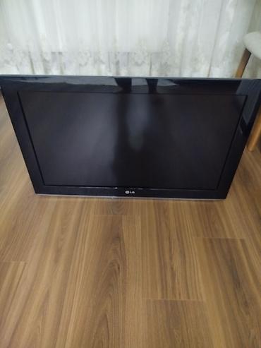 ТВ и видео: LG plazma televizor. Qara rəngli, geniş ekranlı modeldir. Ön hissədə — 1