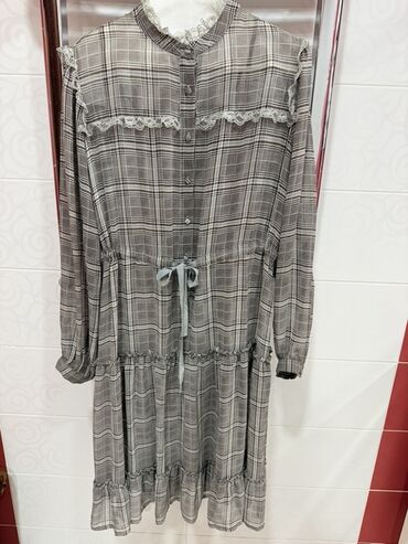 Çimərlik geyimləri: Isabel Garcia qadın donu - Naqış: boz-qəhvəyi tonlarda xallı-çəkməli