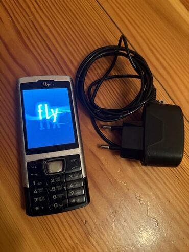 телефон fly с большим аккумулятором: Fly E145, < 2 ГБ, цвет - Серый, Кнопочный