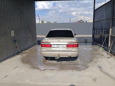 385 55: Mazda 626: 1999 г., Бензин, Седан — 1