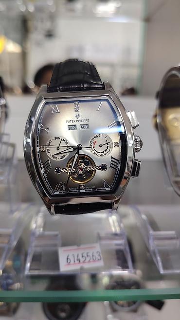 saat omega: Patek Philippe kişi qol saatı – tonneau (yastıqsayağı) korpus dizaynı — 3