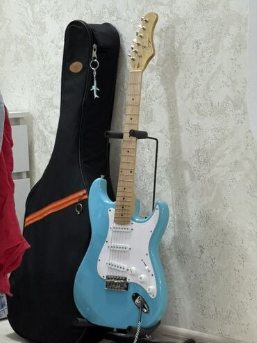 Укулеле: Məhsul: Smiger Elektrik gitara - Korpus: Strat tipli, parlaq açıq