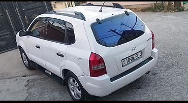 corolla 2006: Hyundai Tucson – ağ rəngli, şəhər və kənd yolları üçün universal — 2