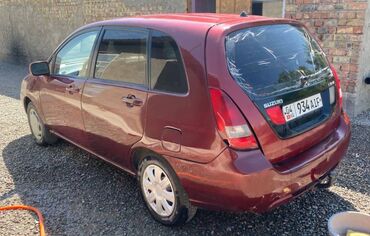 кухня на колесах: Автомобиль Suzuki Liana в кузове хэтчбек, окрашенный в темно-красный