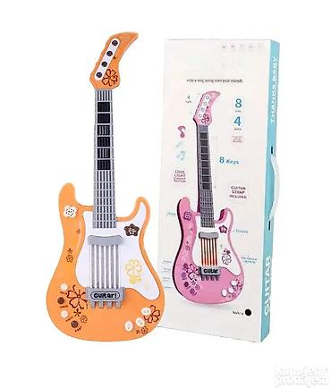 trimer igracka cena: Muzicka gitara koja svetli i svira. muzicka gitara koja svetli i svira — 1