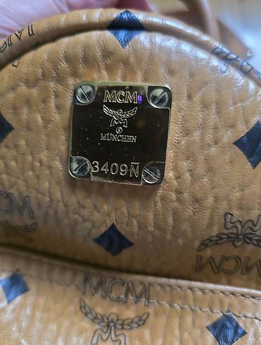 Modni rančevi: MCM mini stark ranac konjak braon boje sa monogram printom. Nov je — 9