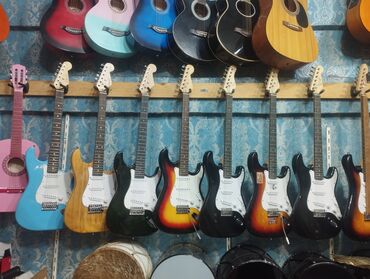 Gitaralar: Çox cuzi işlenmiş elektro gitaralar cemi 99azn. cemi 4ed qalıb. unvan