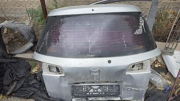 Крышка багажника Mazda Demio (хэтчбек), серебристая. 2 кузов 2002-03 at lalafo.kg Крышка багажника Mazda Demio (хэтчбек), серебристая. 2 кузов 2002-03