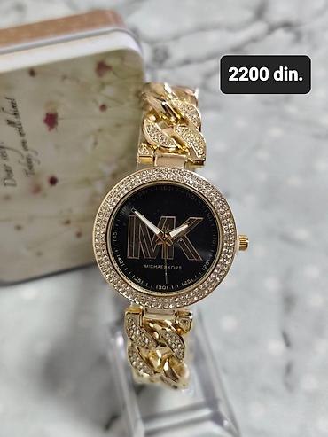 deciji koferi metro: Ženski ručni sat Michael Kors. - Kućište okruglog oblika sa cirkonima — 1