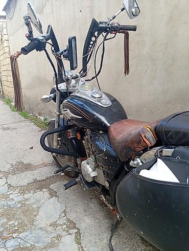 zarya: Kruizer tipli motosiklet Xüsusiyyətlər: - Tək silindrli benzin — 6
