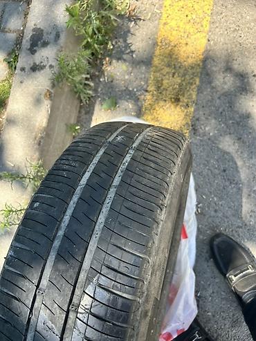 185 65 14 type 0: Michelin markalı avtomobil şini. Ölçüsü: **185/70 R14** Yük/sürət — 2