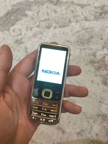 2.el telefonlar: Nokia 6700 Slide, 2 GB, rəng - Gümüşü, Düyməli