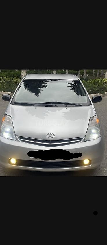 panorama 2008: Toyota Prius (2-ci nəsil, liftback, gümüşü rəng) gündəliy icarəyə — 4