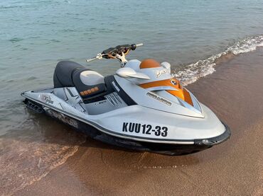 бак на атего: Гидроцикл BRP Sea-Doo белого цвета с оранжевыми и черными акцентами