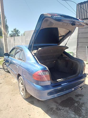 чехол на мопед: Mazda 626: 2000 г., 1.8 л, Механика, Бензин, Лифтбек — 8