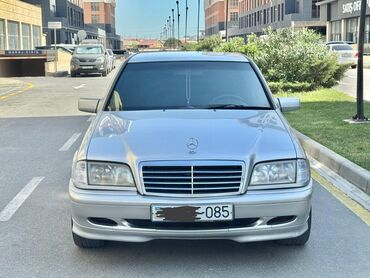 Kommersiya nəqliyyat vasitələri: Mercedes-Benz C‑Class W202 c200 - Kuzov: 4 qapılı sedan, gümüşü rəng