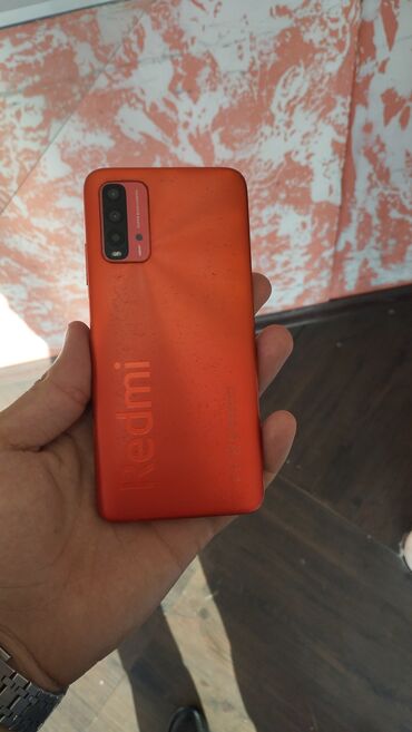 телефон fly tornado: Xiaomi Redmi 9T, 128 ГБ, цвет - Оранжевый, 
 Кнопочный, Отпечаток пальца, Две SIM карты