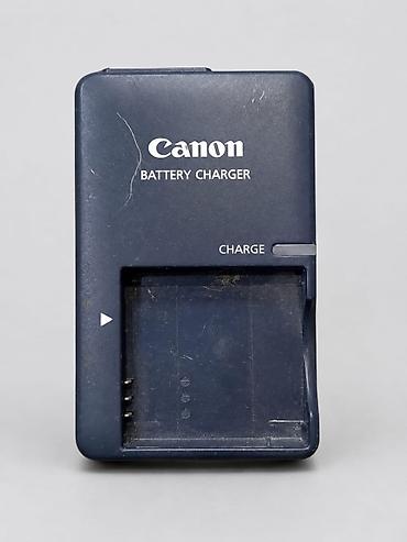 заряд: Зарядное устройство Canon Battery Charger для аккумуляторов камер — 1