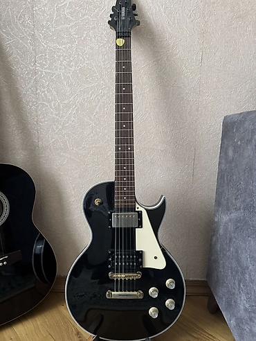 Gitaralar: Les paul terzi elektro gitar, yığılmadır, xeyli müddet gündelik — 1