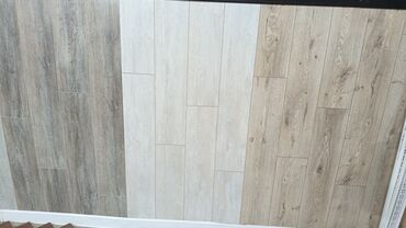 Laminat: Məhsul: Laminat döşəmə örtükləri və aksesuarları Təsvir: - Mağazada — 3