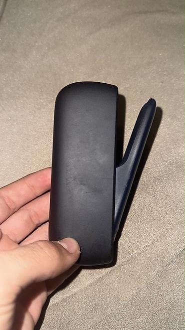 meduza qelyan: IQOS elektron tütün cihazı və qutusu. Tünd rəngli, kompakt və — 3