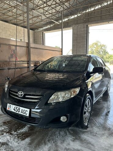 коврик приус: Черный седан Toyota Corolla с легкосплавными дисками. Автомобиль