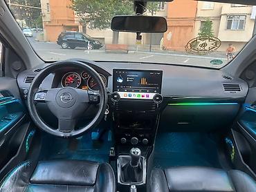 mini cooper 2009: Marka/model: Opel Astra H (hatchback, 5 qapı) Rəng: qara (parlaq) — 6